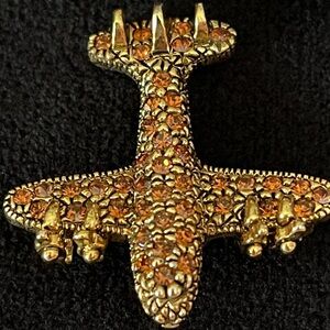 Aviator airplane pin brooch, gold colored with gems, pre 2000.
